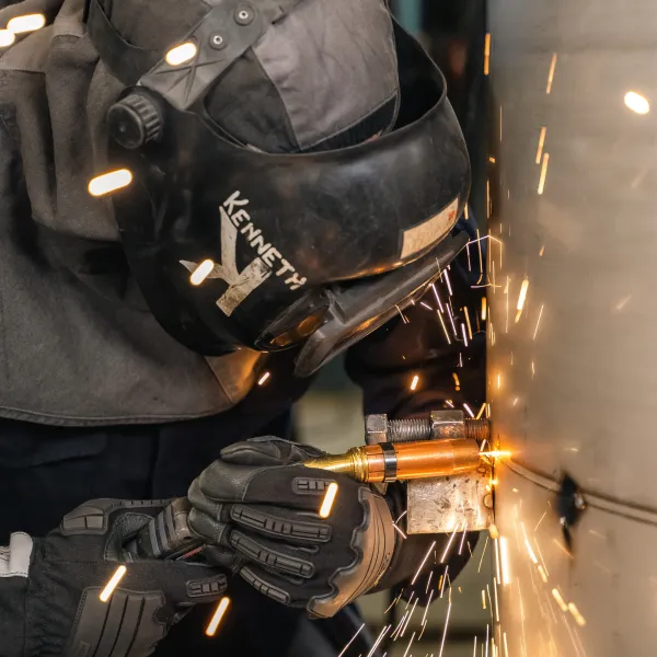 Welder working on tube